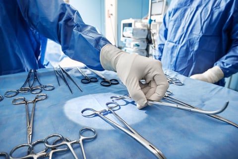 Close-up of sterilized and ready for use surgical instruments on medical tray during surgery operation in operating room at hospital