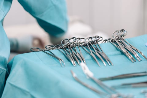 Close-up of sterile surgical instruments during surgery in the operating room