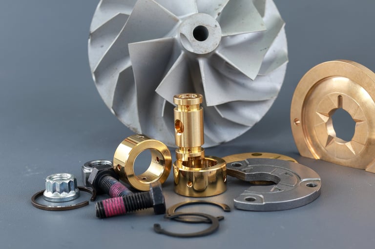 Service kit or Repair kit Turbo charger, including a turbine compressor wheel, O-ring, nuts, bearing, bushing on gray background.