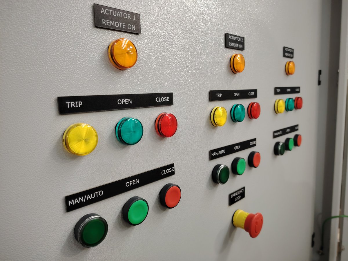 Actuator controls, manual and auto, open, close, and trip status on a monitoring board.
