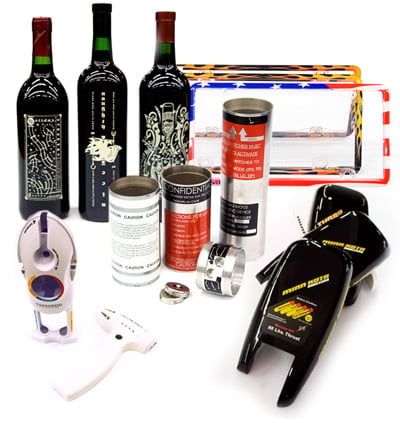 Wine gift set including three wine bottles, corkscrew, wine glasses, candles, and accessories arranged on white background